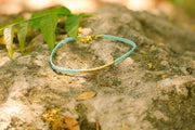 Braided turquoise ankle bracelet with a gold plated long tube - shani-adi-jewerly
