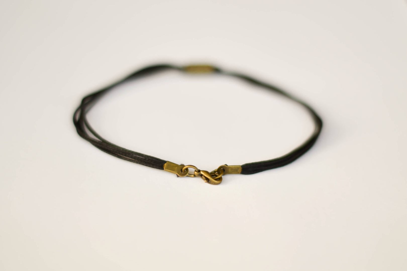 Bronze tube bead anklet for men, black cord - shani-adi-jewerly