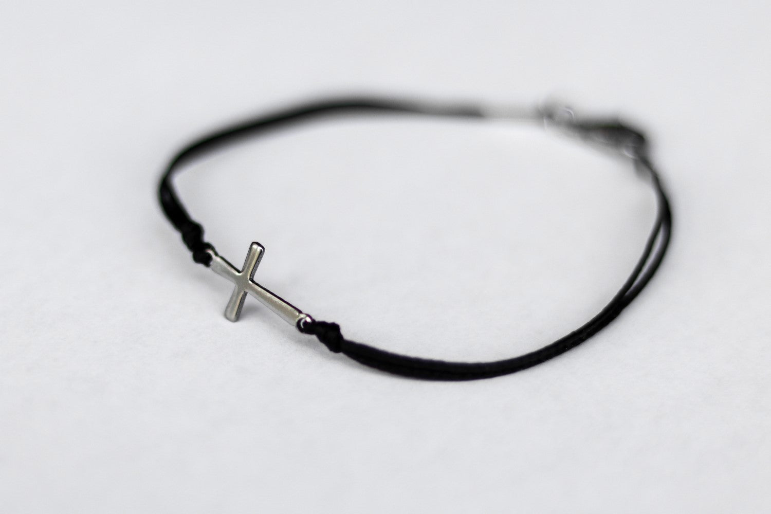 handmade silver cross bracelet for women, black cord - shani and adi jewelry