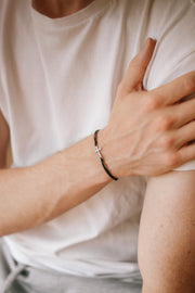 handmade silver cross bracelet for men, black cord - shani and adi jewelry