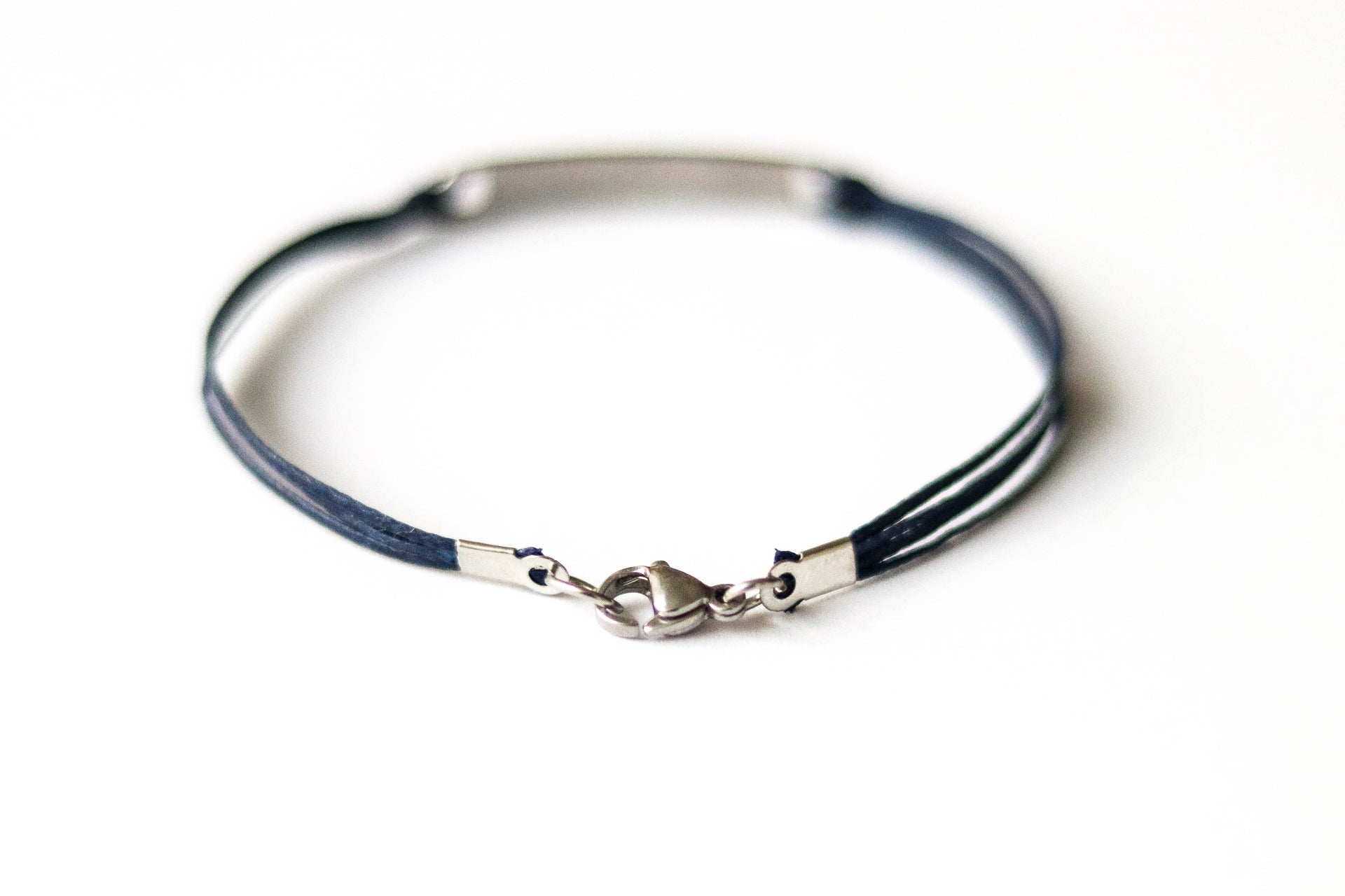 Bracelet with Hebrew text am Israel chai עם ישראל חי on a white background