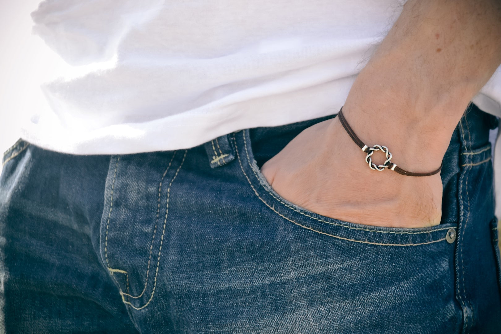 Karma bracelet for men with a silver braided circle charm, brown cord