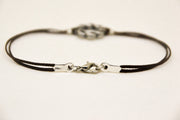 Karma bracelet for men with a silver braided circle charm, brown cord
