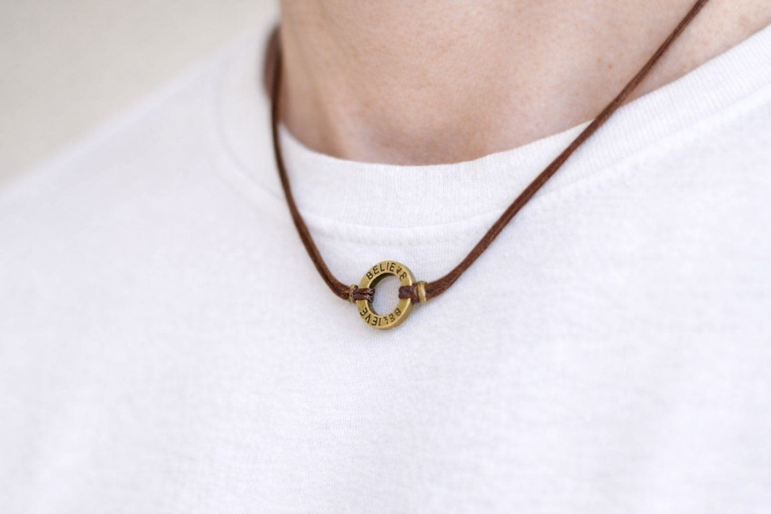 Bronze circle Believe pendant necklace for men, brown cord, mens jewelry