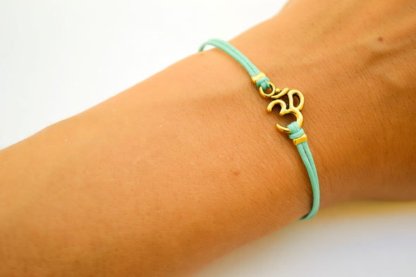 Black cord bracelet with gold tone Om charm, adjustable bracelet for her