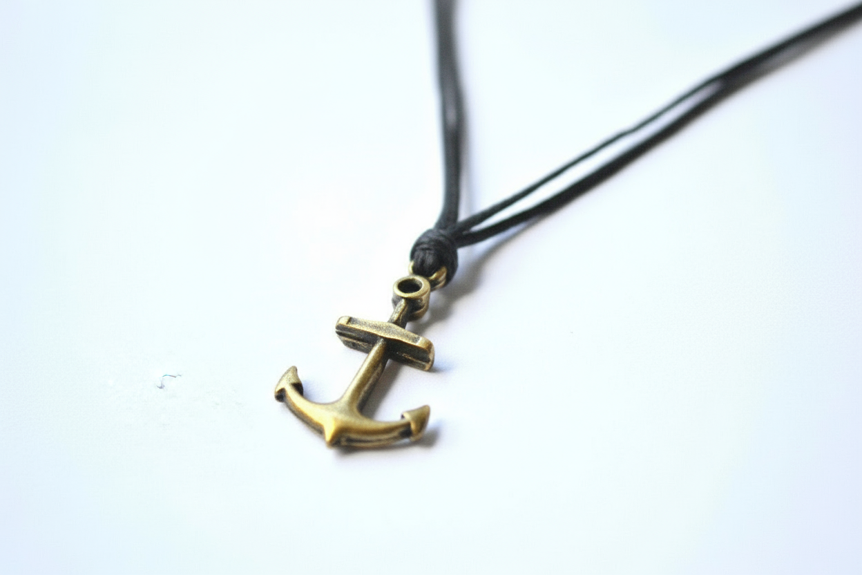 Anchor pendant necklace on a white background