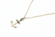 Silver anchor necklace on a white background