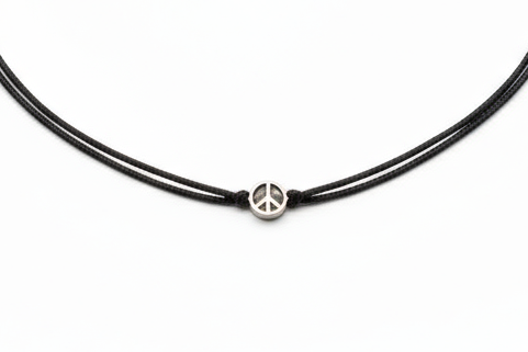 Black cord necklace with a peace sign pendant on a white background