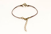 Brown cord bracelet with bronze tone Om charm, for her - shani-adi-jewerly