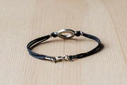 Bracelet for men, silver oval charm, black cord - shani-adi-jewerly