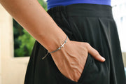 Silver cross charm bracelet, gray cord, adjustable sliding knot - shani-adi-jewerly