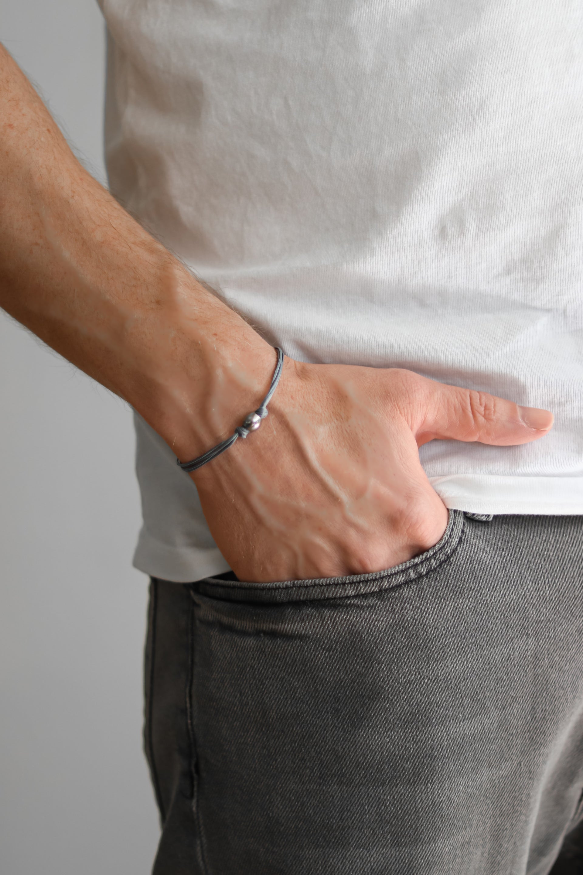 Men's bracelet with silver bead charm and a gray cord - shani-adi-jewerly