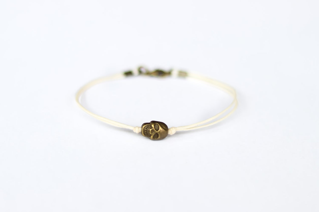 Bronze skull bead bracelet for men with beige cord a gift for him