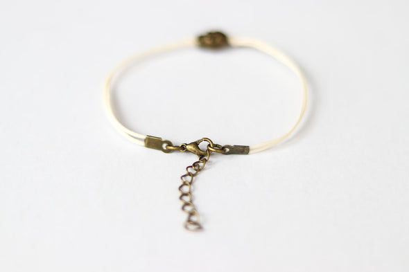 Bronze skull bead bracelet, beige string, gift for her, adjustable bracelet