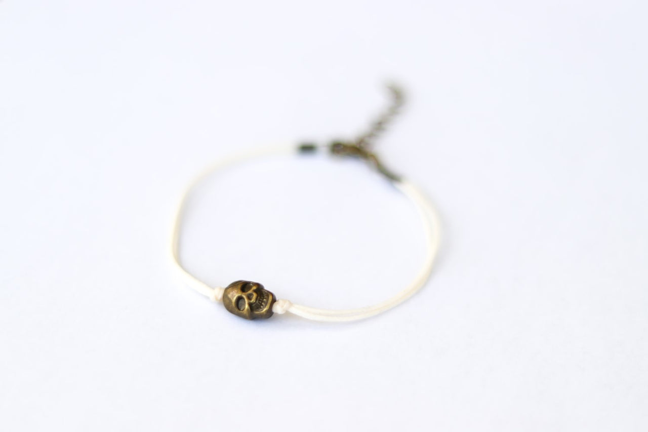 Bronze skull bead bracelet with beige string a gift for her with adjustable closure