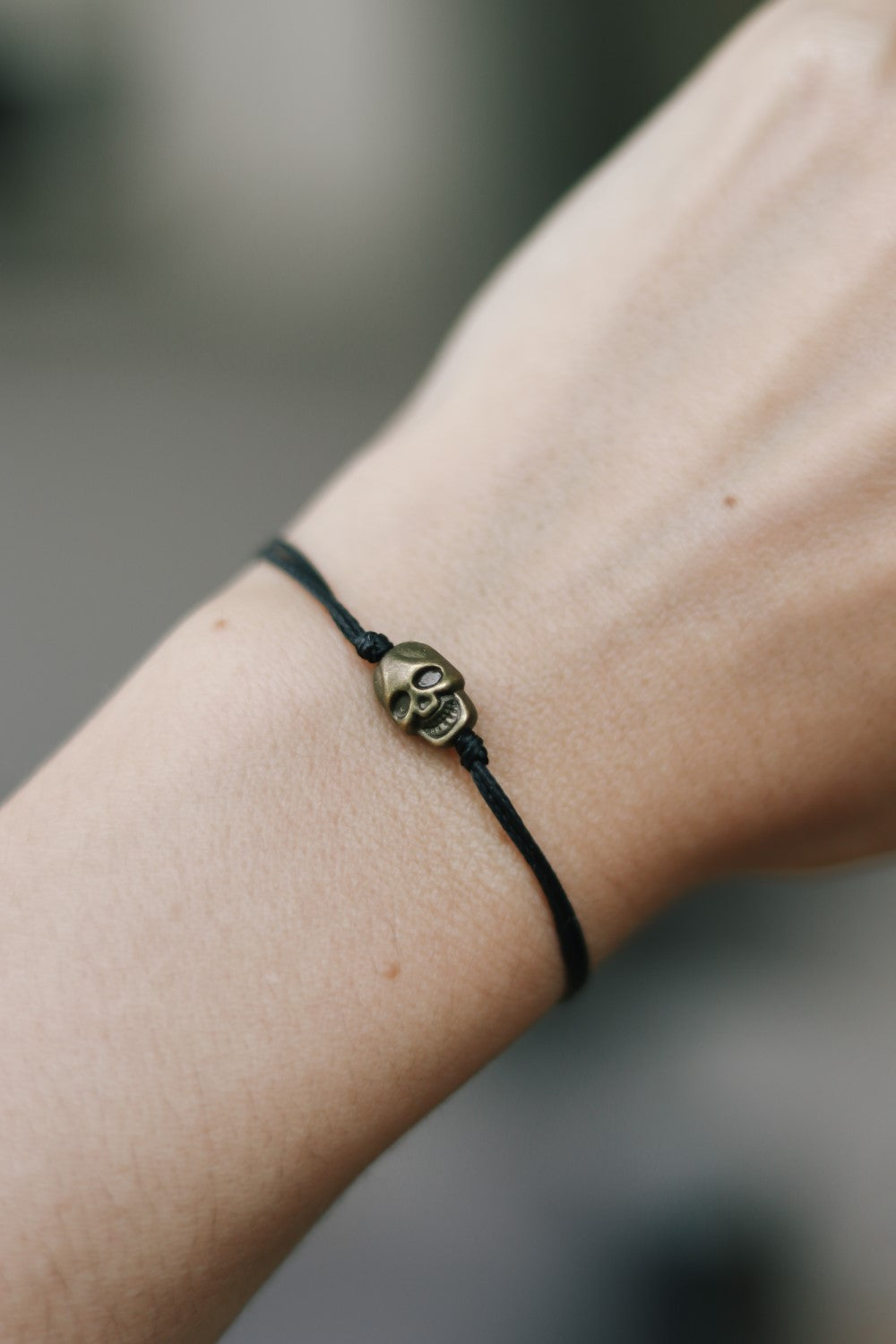 Bronze skull bead bracelet with black string a gift for her with adjustable closure