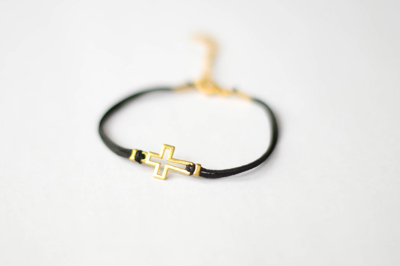 Women's bracelet with gold tone outline cross charm, black cord - shani-adi-jewerly