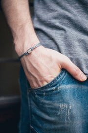 Men's bracelet with a silver tube charm and a gray cord - shani-adi-jewerly
