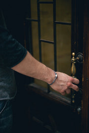 Men's bracelet with a silver tube charm and a gray cord - shani-adi-jewerly