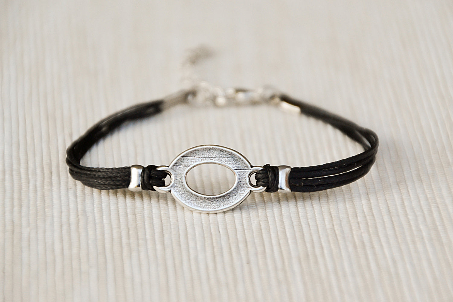 Black cord bracelet with a silver oval circle charm, Mothers day gift - shani-adi-jewerly