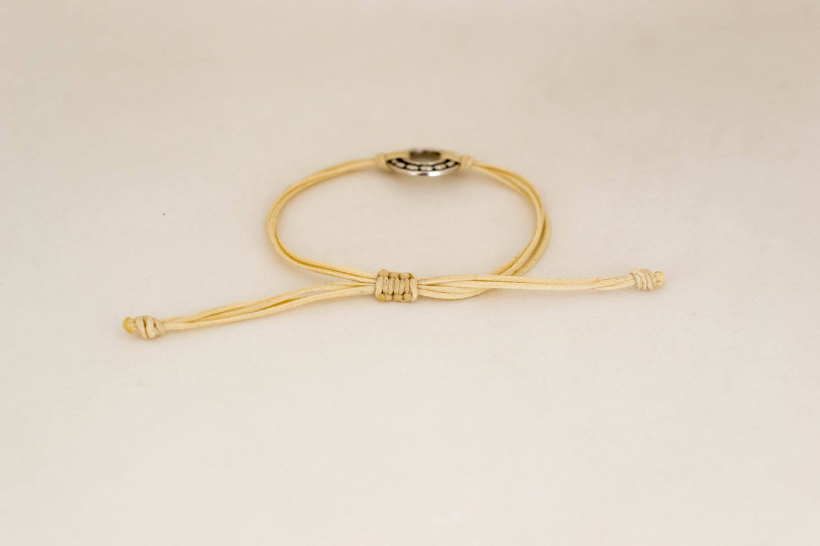 Silver Karma bracelet, beige cord, adjustable sliding knot - shani-adi-jewerly