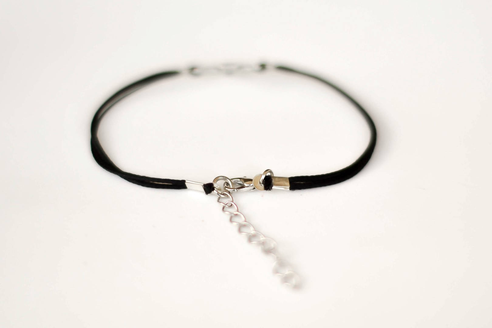Women bracelet with silver outline cross charm, black cord - shani-adi-jewerly