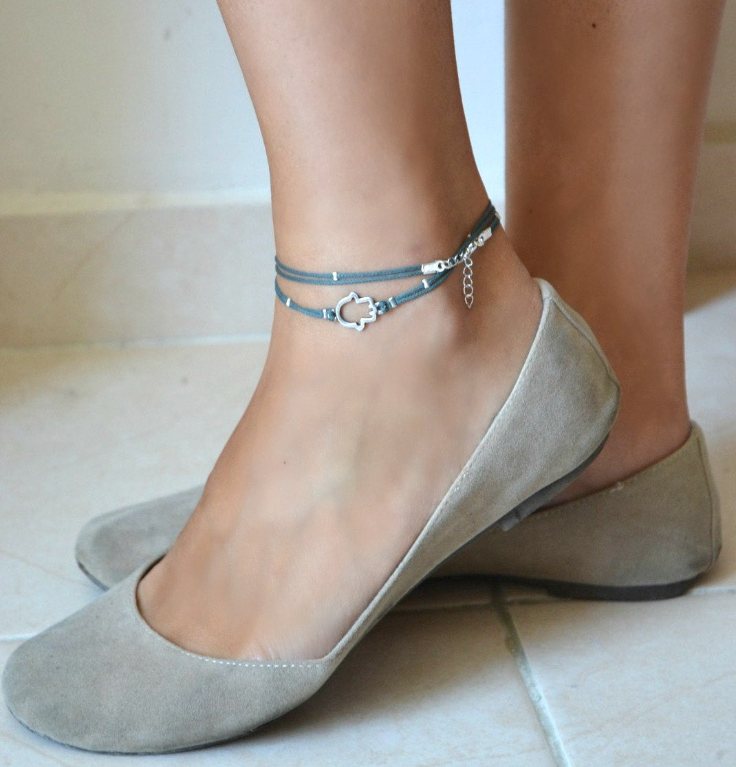 Blue ankle bracelet with a silver Hamsa hand charm - shani-adi-jewerly