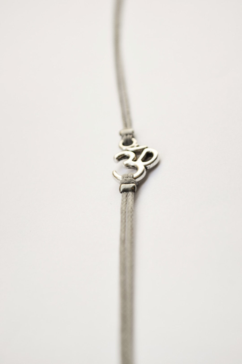 Om bracelet for men, gray cord - shani-adi-jewerly