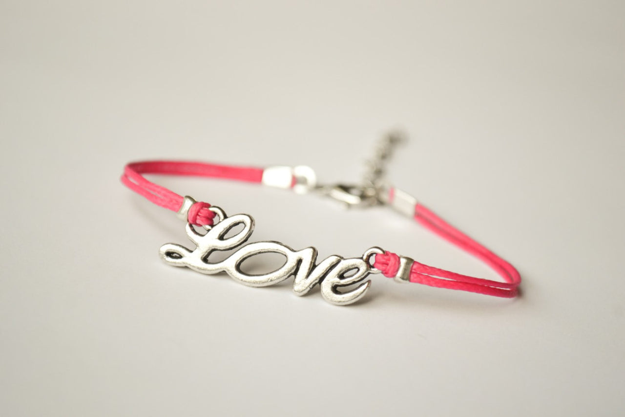 Pink cord bracelet with a silver love charm - shani-adi-jewerly