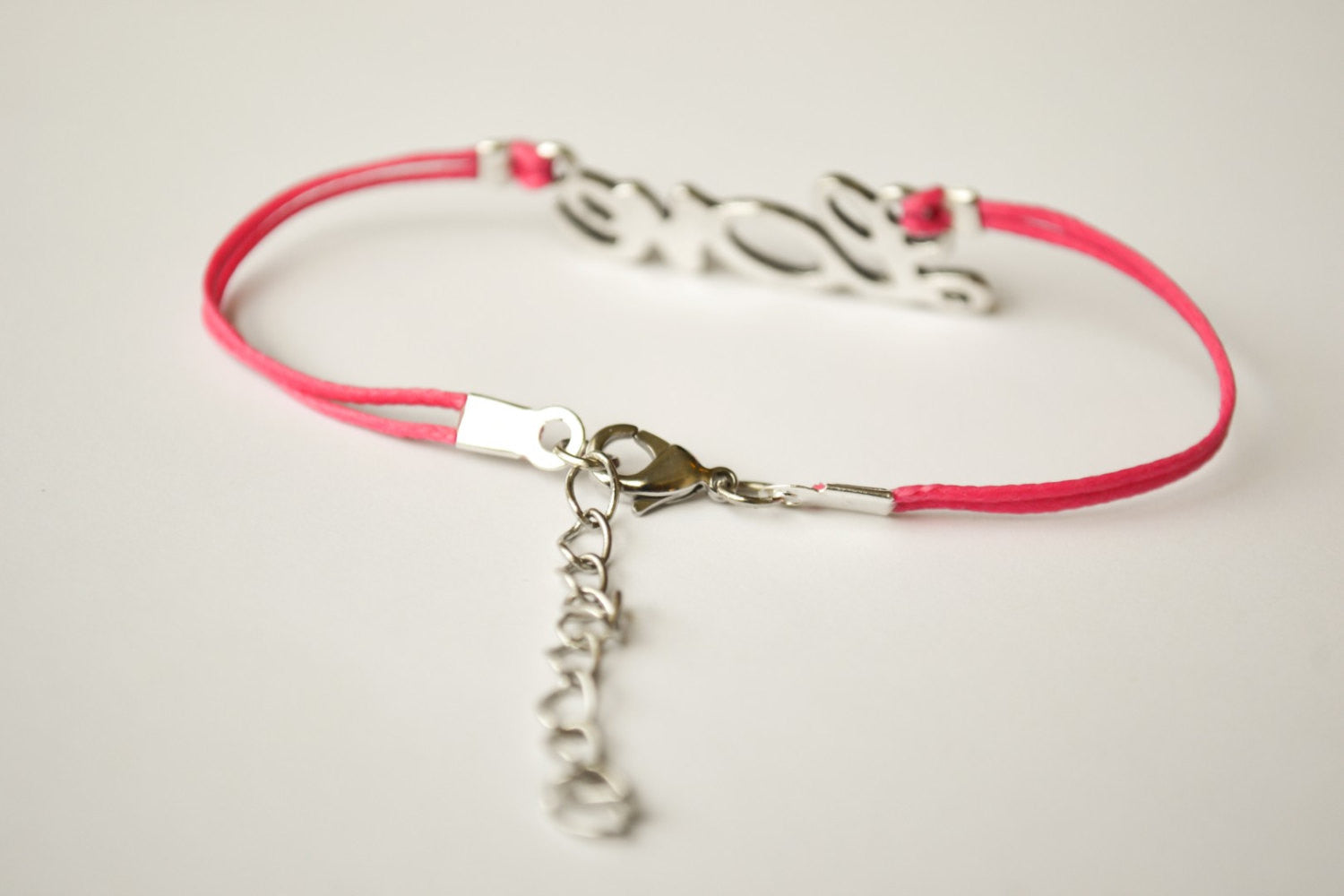 Pink cord bracelet with a silver love charm - shani-adi-jewerly