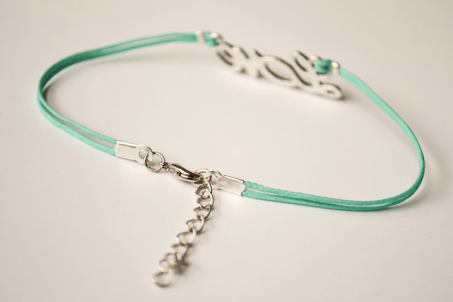Dainty turquoise cord anklet with a silver love charm - shani-adi-jewerly