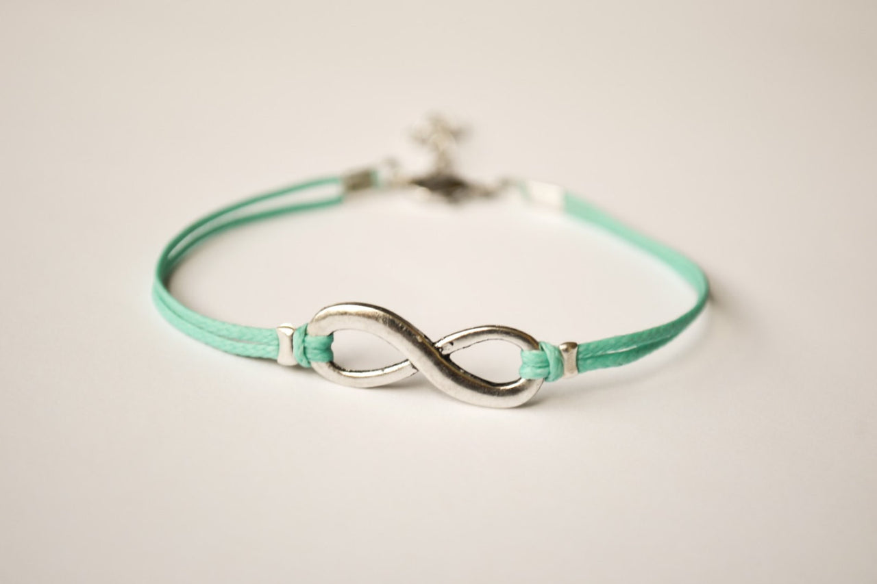 turquoise cord bracelet with a silver infinity charm - shani-adi-jewerly