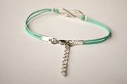 turquoise cord bracelet with a silver infinity charm - shani-adi-jewerly