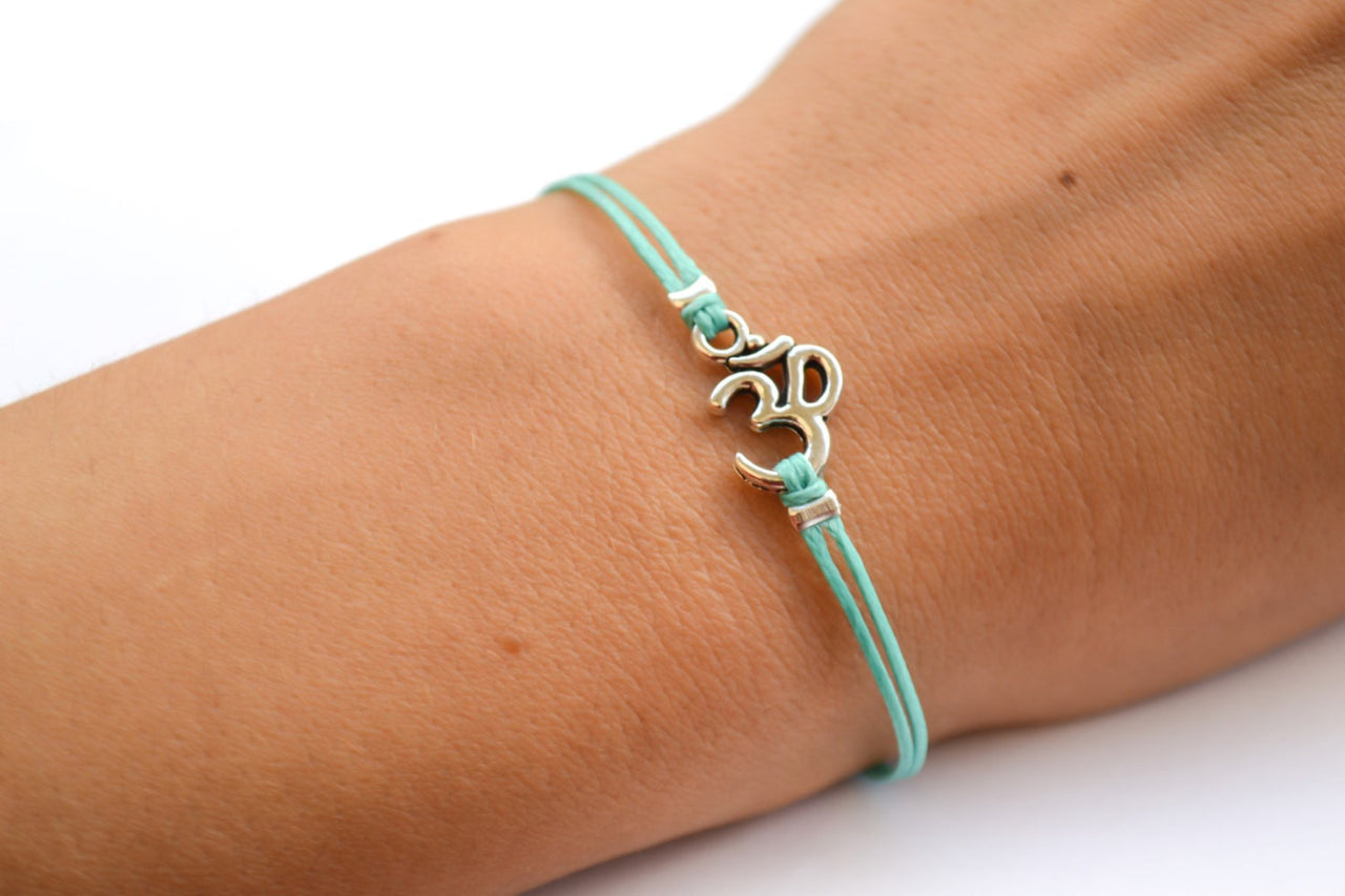 Turquoise bracelet with Tibetan silver Om charm - shani-adi-jewerly