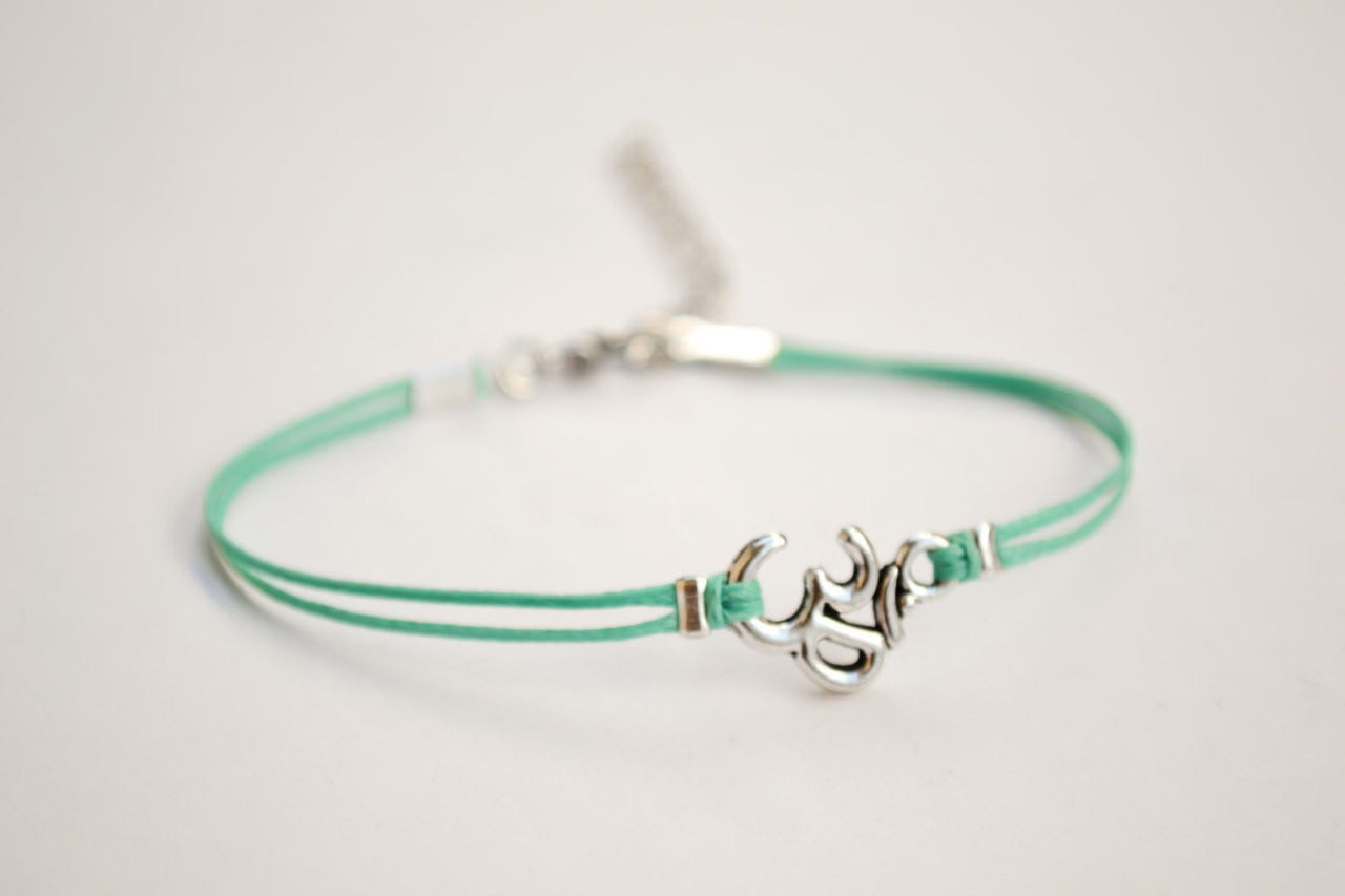Turquoise bracelet with Tibetan silver Om charm - shani-adi-jewerly
