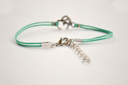 Turquoise bracelet with Tibetan silver Om charm - shani-adi-jewerly
