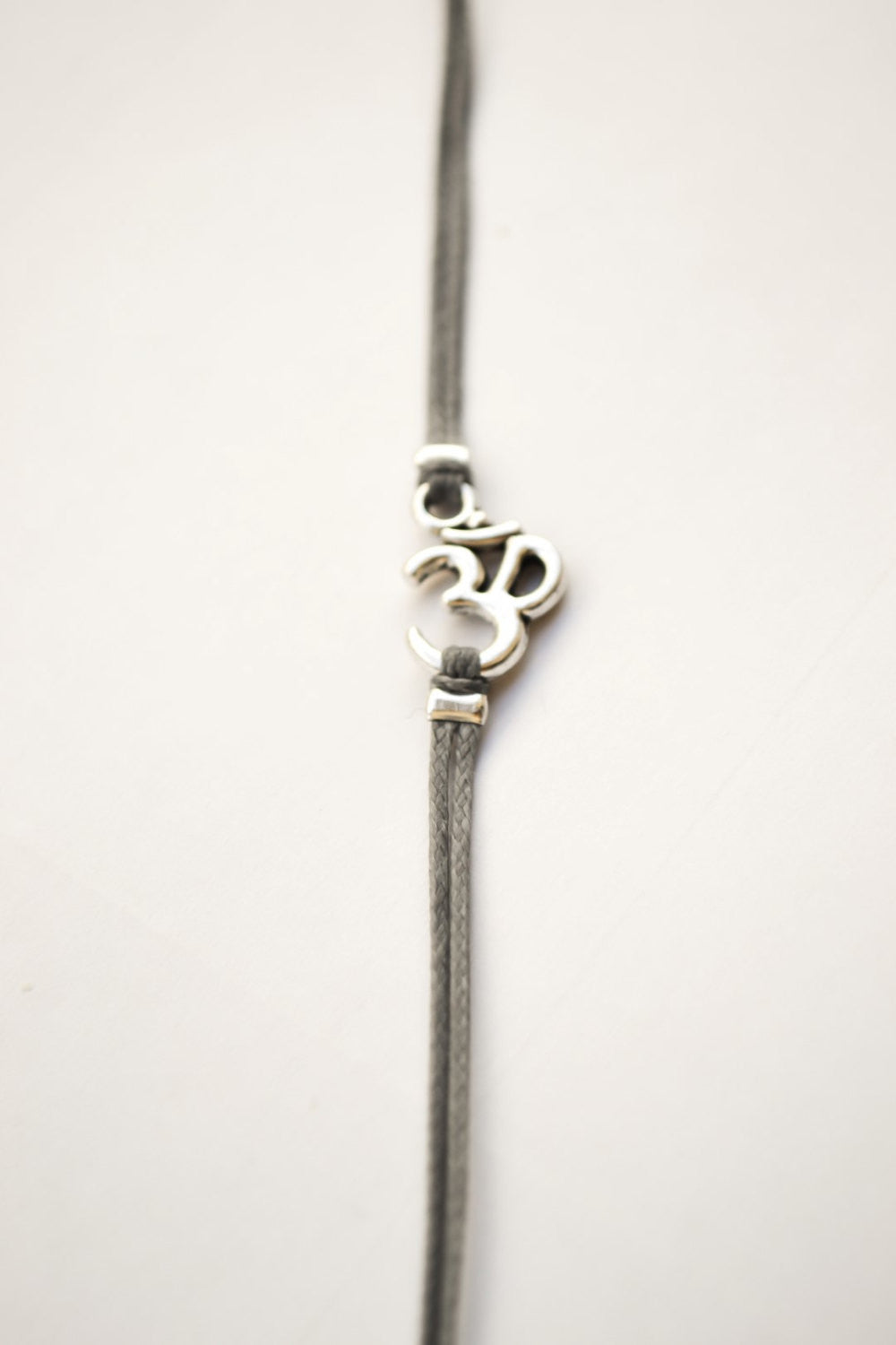 Wrapped om bracelet, gray cord - shani-adi-jewerly