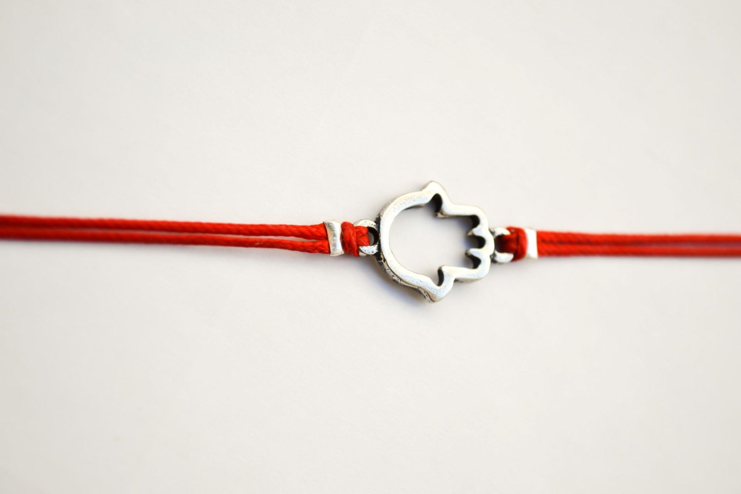 Red wrapped bracelet with a silver Hamsa charm, Kabbalah bracelet - shani-adi-jewerly