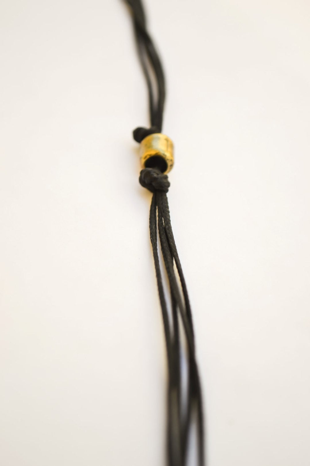 Bronze tube necklace for men, black cord - shani-adi-jewerly