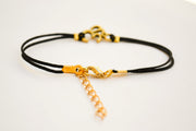 Black cord bracelet with gold tone Om charm, adjustable bracelet for her - shani-adi-jewerly