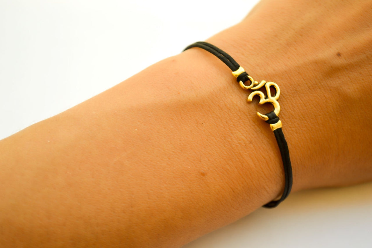 Black cord bracelet with gold tone Om charm, adjustable bracelet for her - shani-adi-jewerly