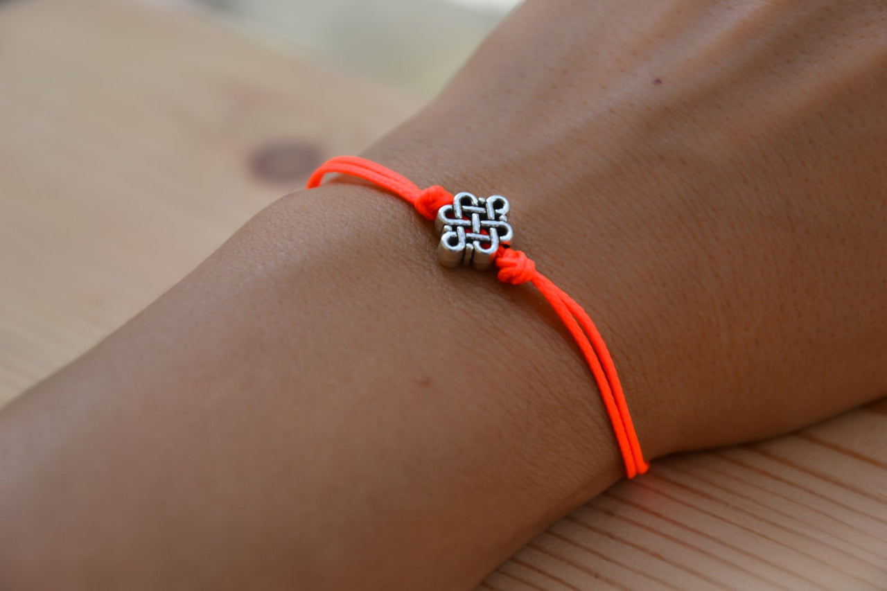 Bright peach cord bracelet with a silver endless knot bead - shani-adi-jewerly