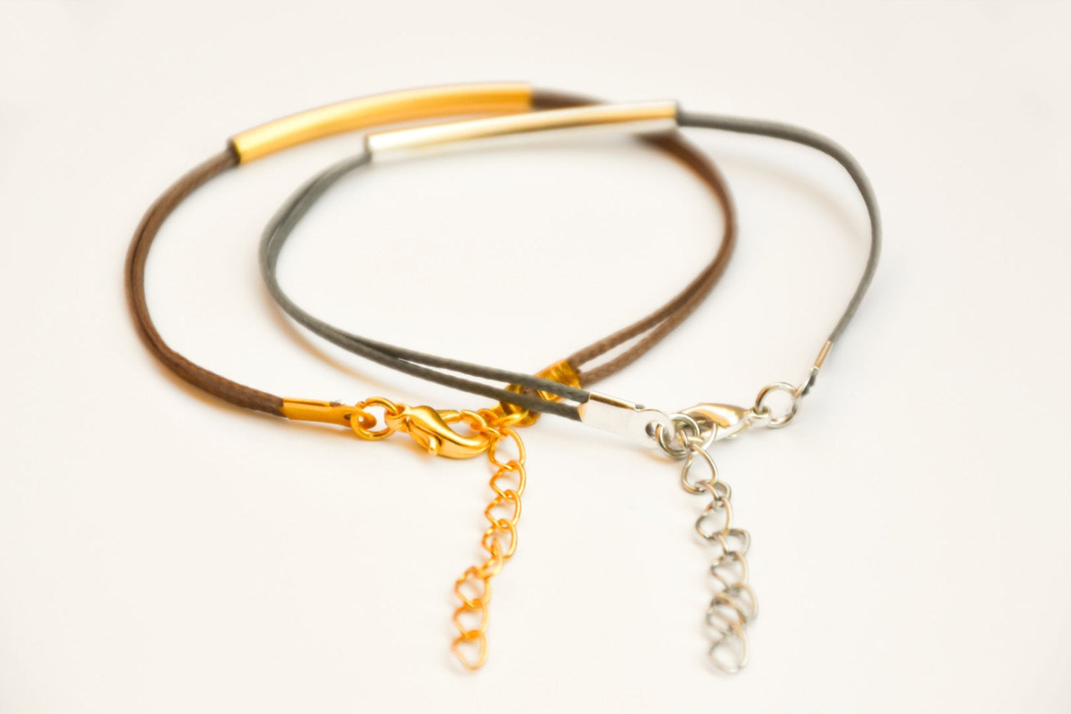 Silver and gold plated tube charms bracelets, gray and brown cords - shani-adi-jewerly