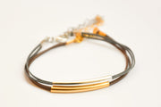 Silver and gold plated tube charms bracelets, gray and brown cords - shani-adi-jewerly