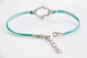 Turquoise cord bracelet with a silver hamsa charm - shani-adi-jewerly