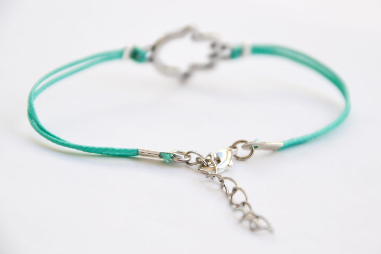 Turquoise cord bracelet with a silver hamsa charm - shani-adi-jewerly