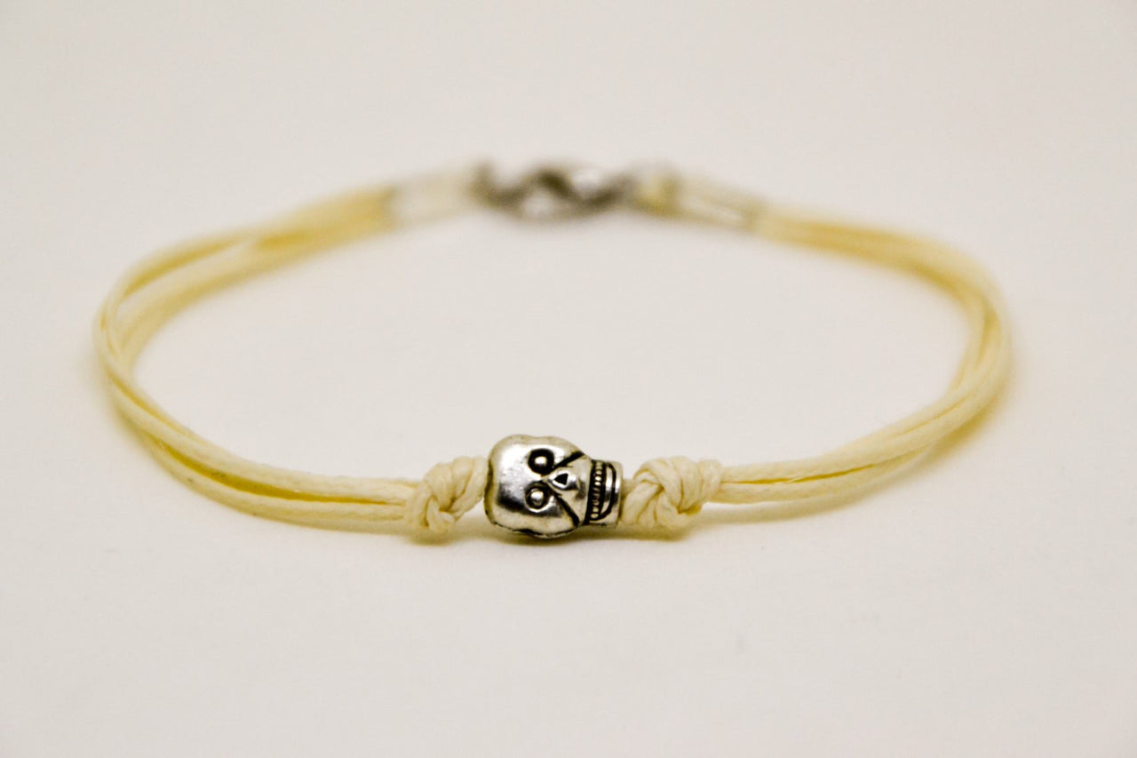 Silver skull bracelet for men, beige cord - shani-adi-jewerly