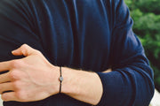 Silver round charm bracelet for men, black cord - shani-adi-jewerly
