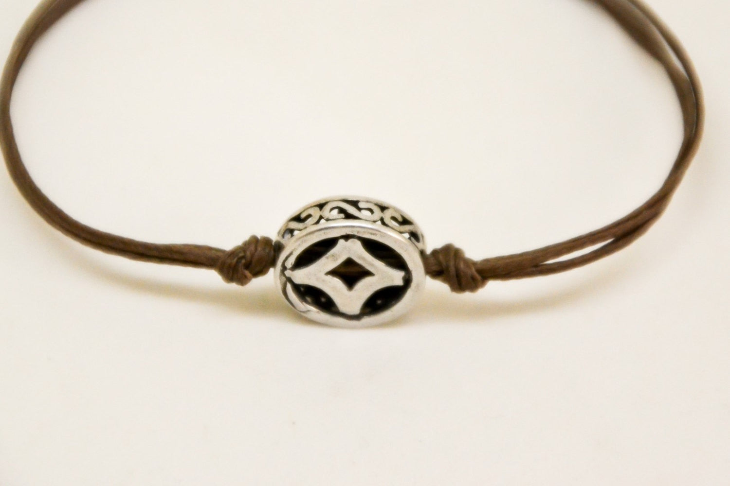 Brown cord bracelet with decorated silver circle bead charm - shani-adi-jewerly