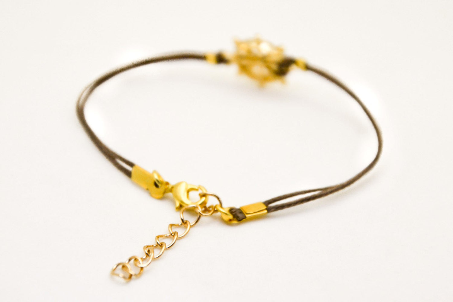 Brown cord bracelet with a 14k gold plated Ship wheel charm - shani-adi-jewerly